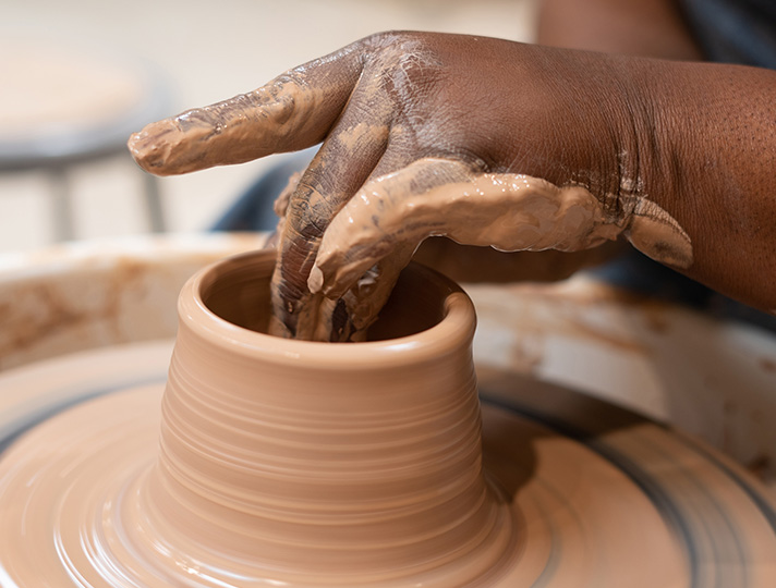 Parent on the pottery wheel